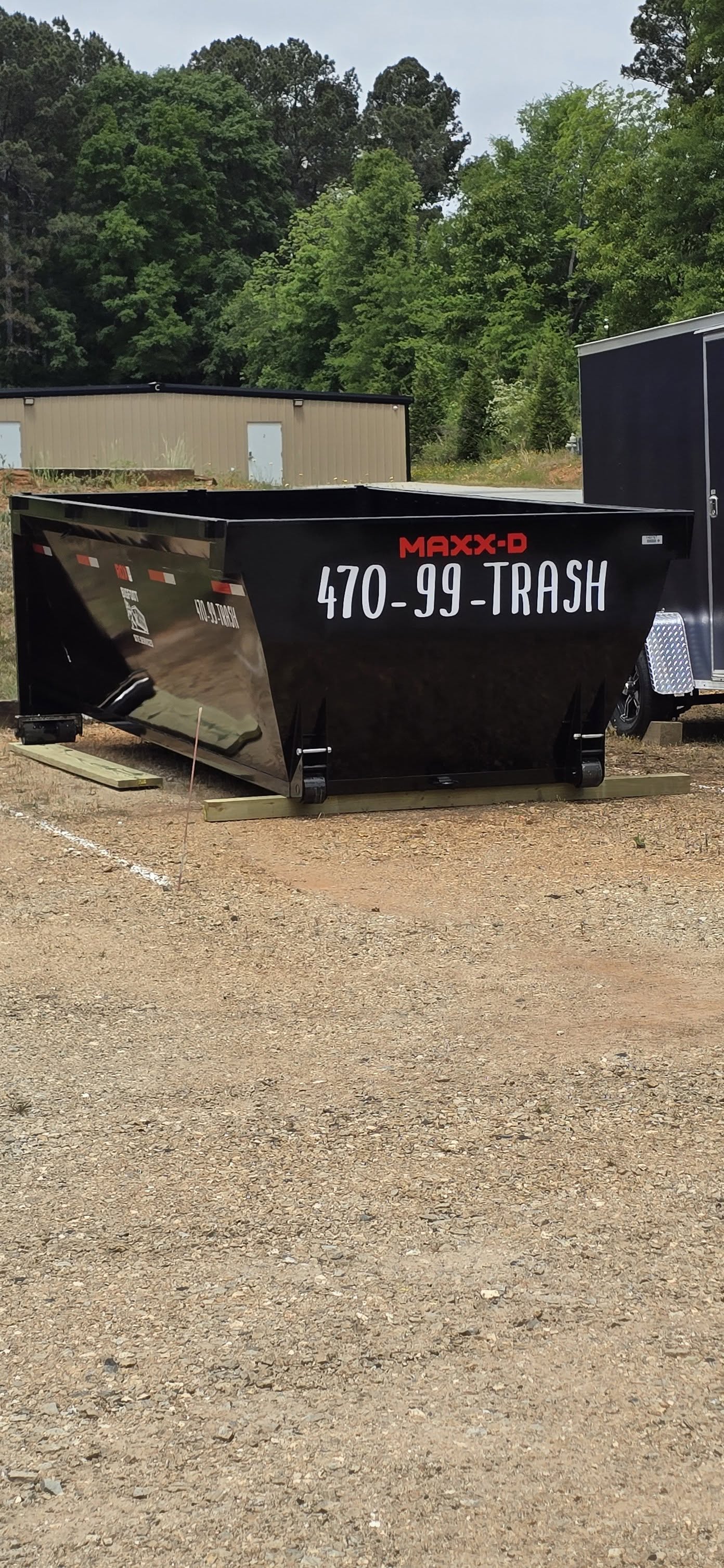 Bigfoot Site Services dumpster staged for yard waste and green debris disposal