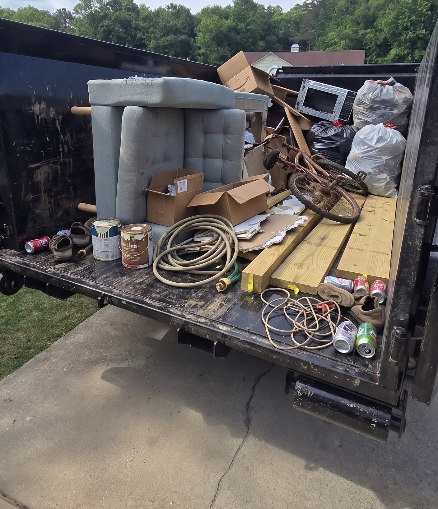 Bigfoot Site Services crew loading furniture and junk for removal in Georgia